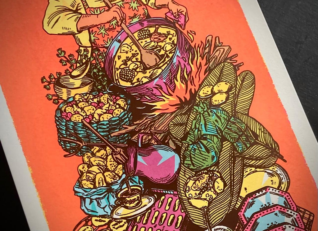 Detail of colorful illustration of a person cooking over a fire with various food items and utensils on an orange background at Ocio Gallery in Bogota, Colombia